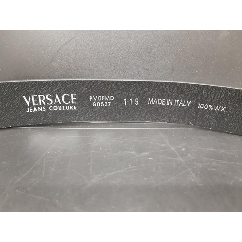 357 - An Italian Versace crocodile skin black leather men's belt - measuring approx. 115cm