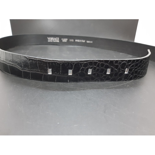 357 - An Italian Versace crocodile skin black leather men's belt - measuring approx. 115cm