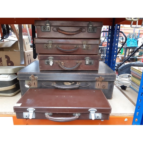 368 - Five various vintage brown leather cases to include three briefcases, one suitcase and a masonic cas... 