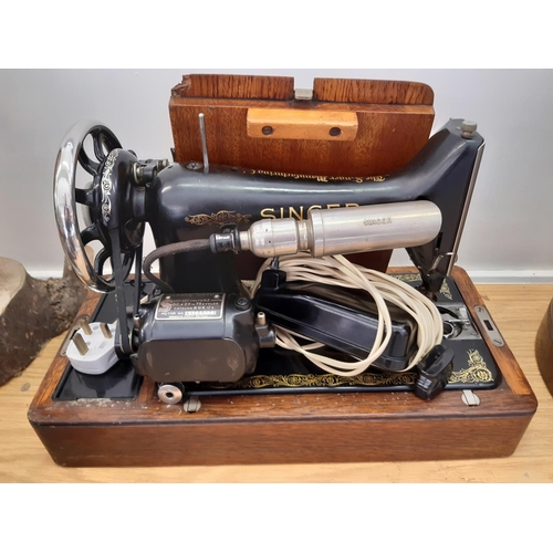 377 - A vintage oak cased Singer 230/240v electric sewing machine - motor no. K4259023