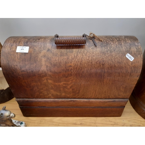 377 - A vintage oak cased Singer 230/240v electric sewing machine - motor no. K4259023