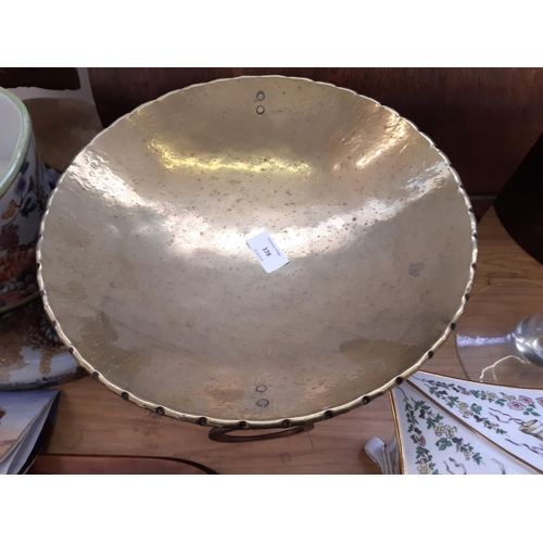 378 - An Arts and Crafts English made 'Olbury' hand beaten brass pedestal dish - measuring approx. 28cm hi... 