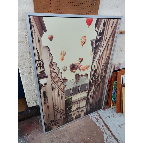 468 - Five various sized mirrors and a large canvas print of a continental street sign with various hot ai... 