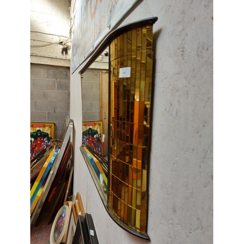 470 - An Art Deco bow fronted wall mirror with gold coloured mosaic mirrored sides and oriental fisherman ... 