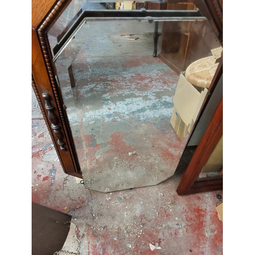 475 - Three vintage mirrors to include two Art Deco bevel edged frameless wall mirrors and a vintage oak f... 