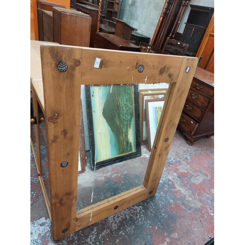 478 - A large rustic pine framed rectangular wall mirror - measuring approx. 88cm wide and 119cm high