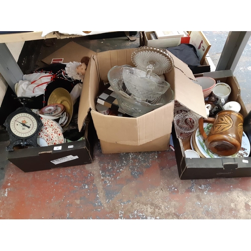 389 - Three boxes containing mixed items to include a set of Victorian style cast metal kitchen scales, la... 