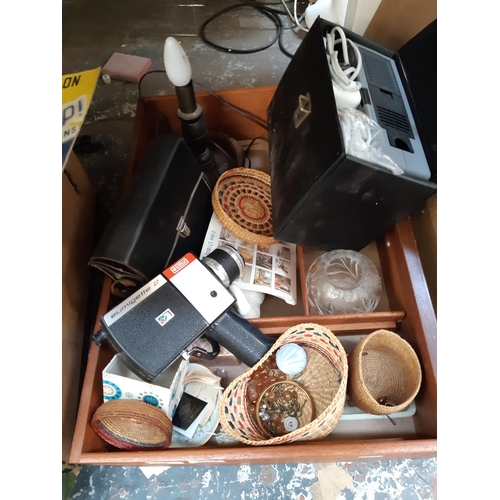 404 - A drawer containing mixed items to include an Eumig Eumigette No.2 cased camcorder, oak table lamp, ... 