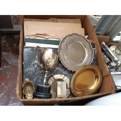 415 - A box containing mixed items to include sheet music, bakelite records, metalware etc.