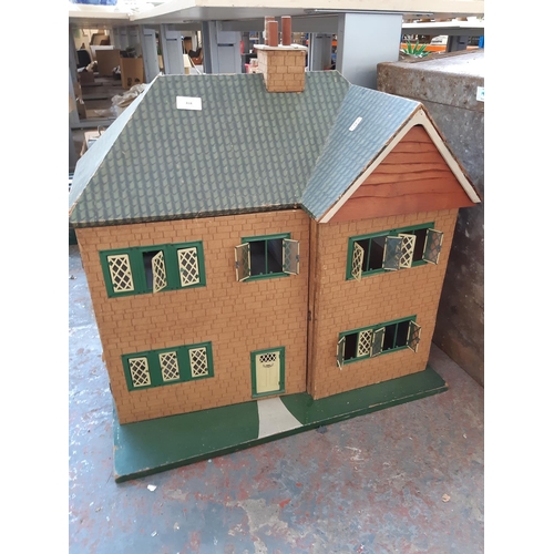 418 - A vintage hand painted child’s dolls house - measuring approx. 63cm in width and 62cm in height