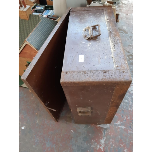 419 - A vintage square brown metal storage chest