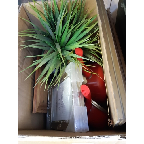 424 - A box containing mixed items to include artificial plants, photo frame, framed watercolour of a moun... 