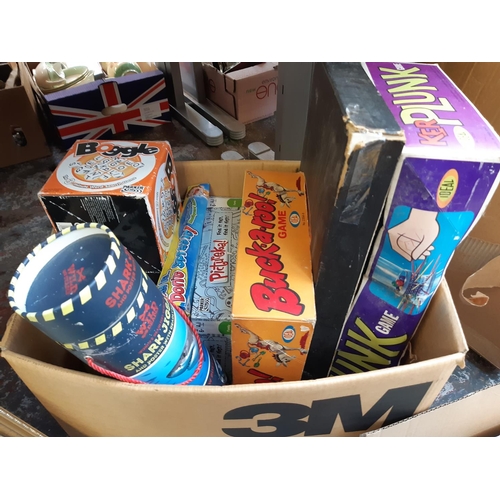 425 - A box containing a quantity of various board games to include Kerplunk, Buck-a-roo, Boggle etc. toge... 