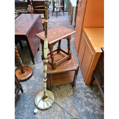 543 - Three items to include an onyx and brass standard lamp, oak side table and an Art Deco oak coffee ta... 