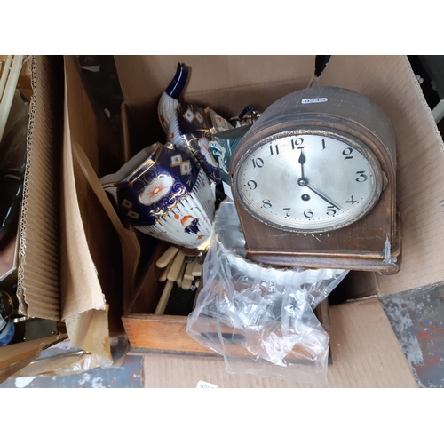 436 - Three boxes containing mixed items to include an oak cased napoleon hat shaped chiming mantel clock,... 