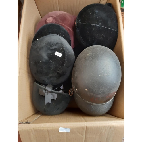 442 - A box containing a large quantity of horse riding hats