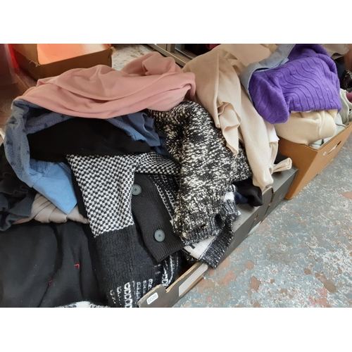 446 - Four boxes containing a large quantity of good quality men's jumpers ranging from size XL to XXL to ... 