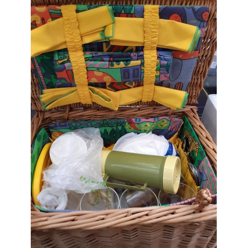 450 - A vintage wicker picnic basket with contents