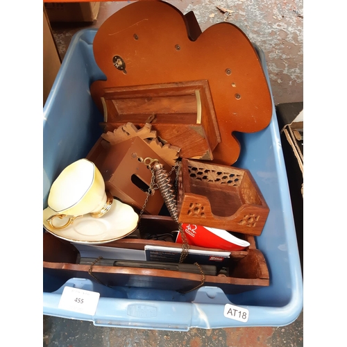 455 - A box containing mostly treenware to include an Indian hardwood desk tidy, magazine rack, cuckoo clo... 