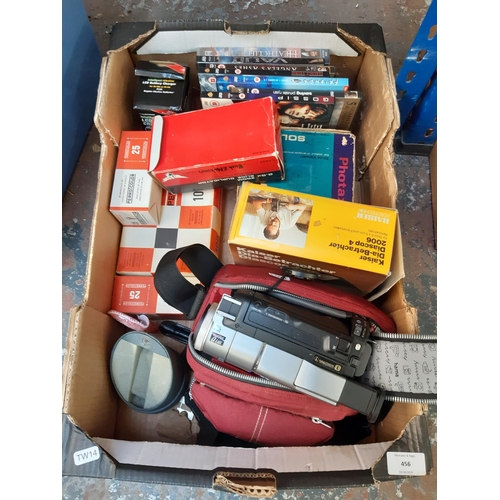 456 - A box containing mixed items to include DVDs, boxed Photax Solar 3 slide viewer, 2.5x zoom slide dup... 