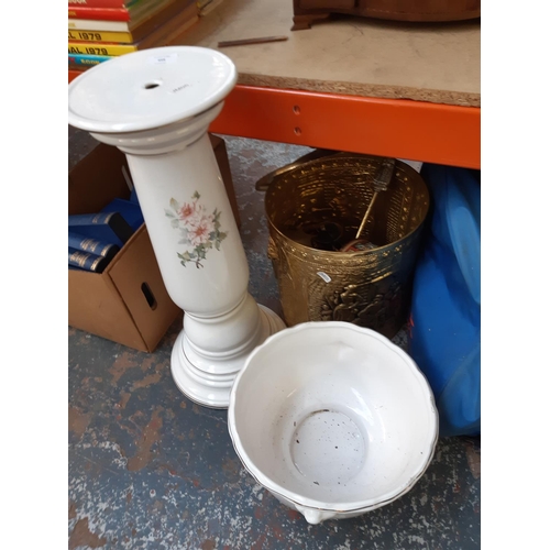 458 - A large clearance lot of mixed items to include walking canes, ceramic jardiniere and stand, embosse... 