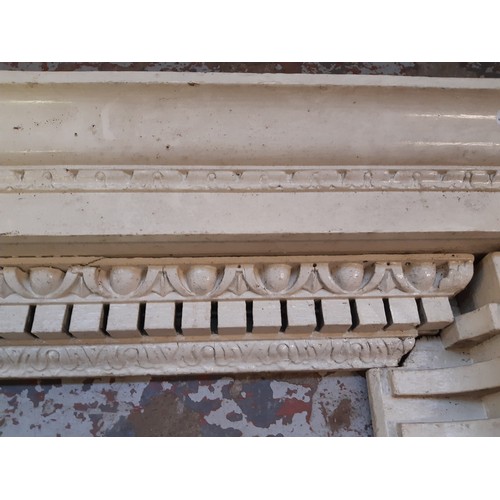 772 - A white painted vintage wooden ornate mantelpiece measuring approx. 172cm wide and 94 1/2cm high