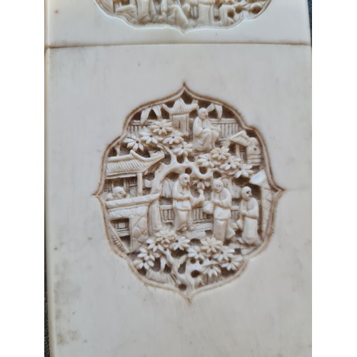 132 - An antique oriental carved card case with figural and garden design - measuring approx. 10cm high an... 