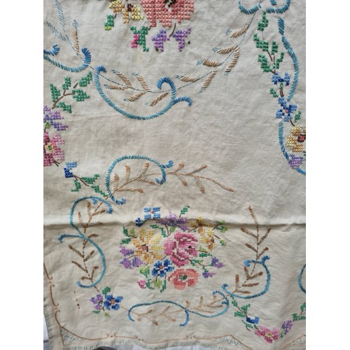 251 - A suitcase containing a large quantity of vintage linen together with various fabric patterns and se... 