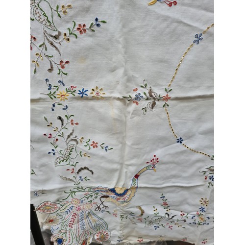 251 - A suitcase containing a large quantity of vintage linen together with various fabric patterns and se... 