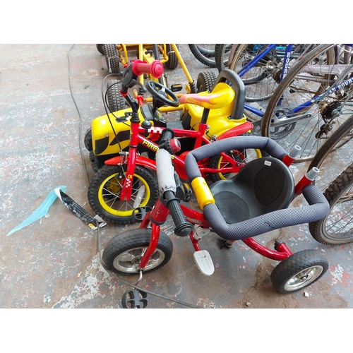 706 - Three ride on child's toys to include a black and yellow JCB tractor, red Apollo Fire chief BMX and ... 