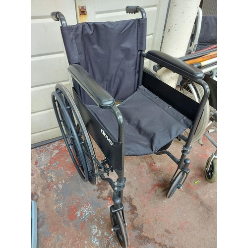 716 - Five items to include a black Drive self-propelled folding wheelchair, three grey metal folding pati... 