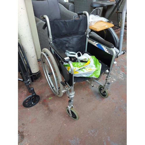 717 - Various mobility equipment to include a black Enigma self-propelled folding wheelchair and a selecti... 