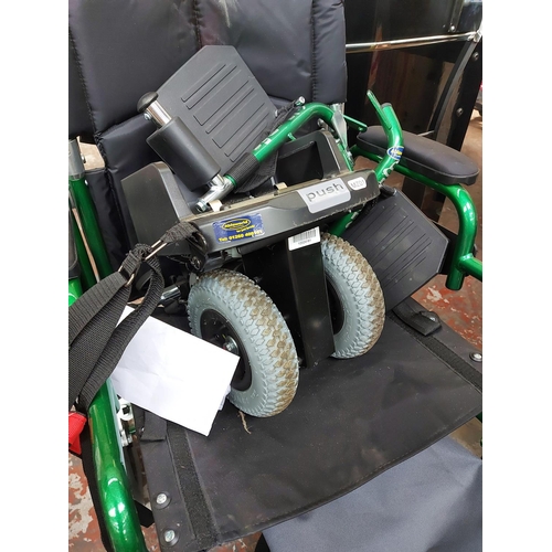 729 - Two items of mobility equipment to include a black and green Enigma folding wheelchair and an Ablewo... 