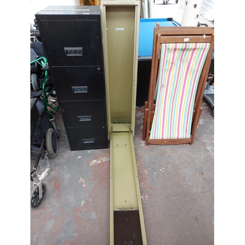 731 - An Apollo Security green metal gun cabinet with key - measuring approx. 131cm high, 27cm deep and 30... 