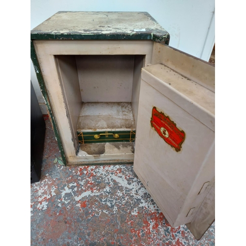 744 - A Victorian Samuel Withers & Co. Ltd of West Bromwich green painted steel safe with internal drawer ... 