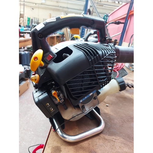 771 - A black and red Homelite HBV30A petrol leaf blower