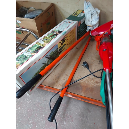 777 - A boxed green Black & Decker GT220C electric hedge trimmer with 16