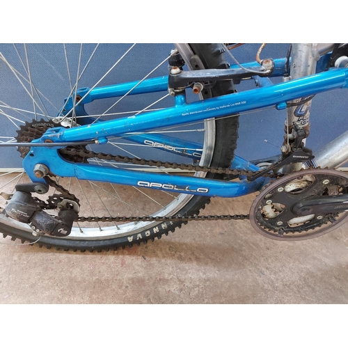 711 - Two bikes to include a blue Peugeot Formula girls mountain bike with 10 speed Shimano gear system an... 