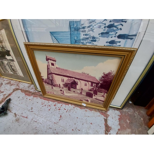 430 - Two framed prints to include L.S. Lowry 'Going to the match 1953' and a church scene