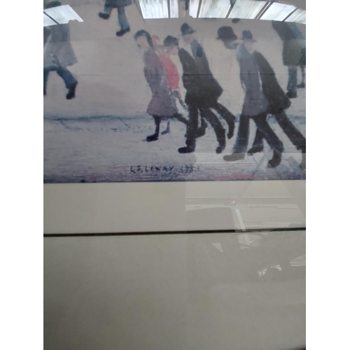 430 - Two framed prints to include L.S. Lowry 'Going to the match 1953' and a church scene