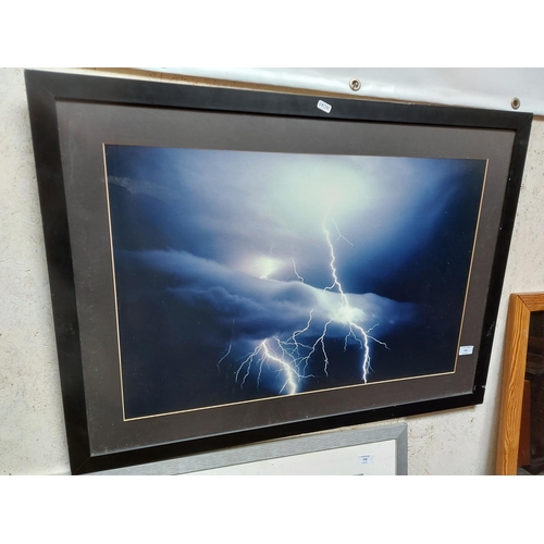 453 - A framed photograph of lightning