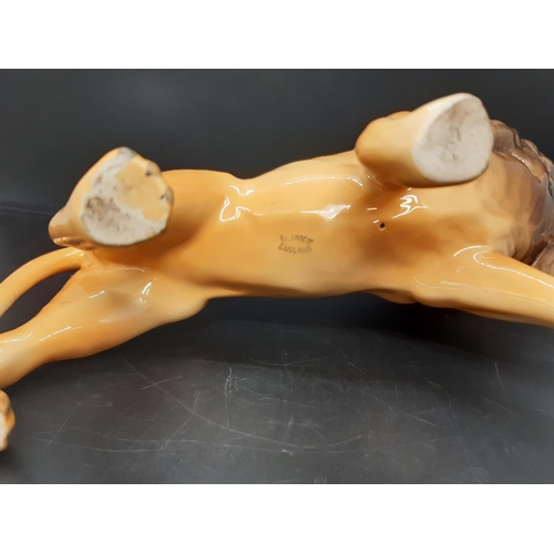 100 - A Beswick lion facing left figurine - model no. 2089