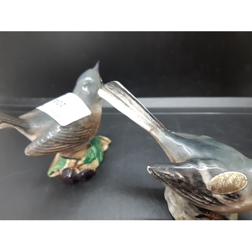 104 - Three Beswick bird figurines to include grey wagtail -  model no. 1041, whitethroat - model no. 2106... 