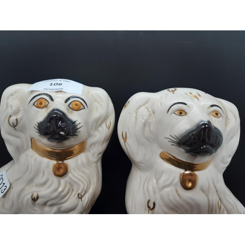 106 - Two Royal Doulton white King Charles spaniel 'wally dog' figurines - both model no. 1378-5 (see cond... 