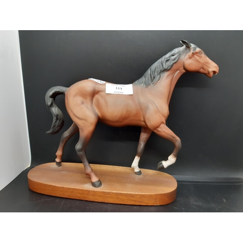 113 - A Beswick 'Spirit of Fire' horse figurine on wooden plinth