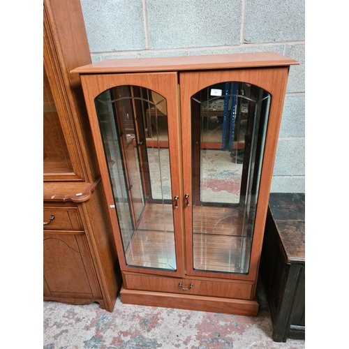 459 - Two items to include a Morris furniture teak effect display cabinet with two glazed doors and a simi... 