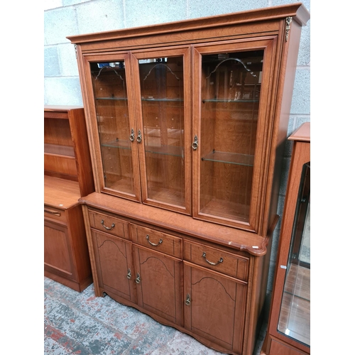 459 - Two items to include a Morris furniture teak effect display cabinet with two glazed doors and a simi... 