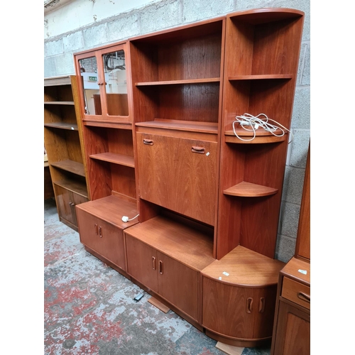 461 - A 1970s G Plan Fresco teak three piece living room suite comprising corner cabinet with two lower cu... 