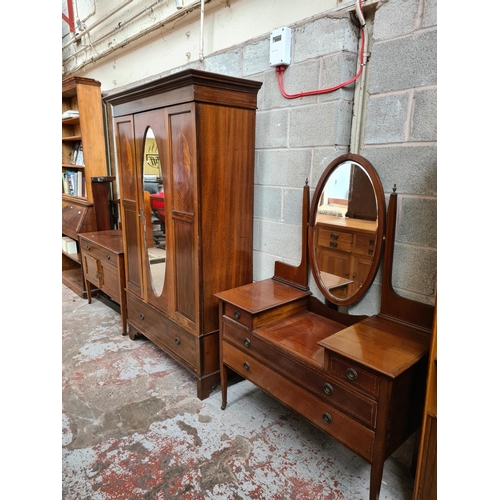 463 - An Edwardian inlaid mahogany four piece bedroom suite comprising dressing table with oval bevel edge... 