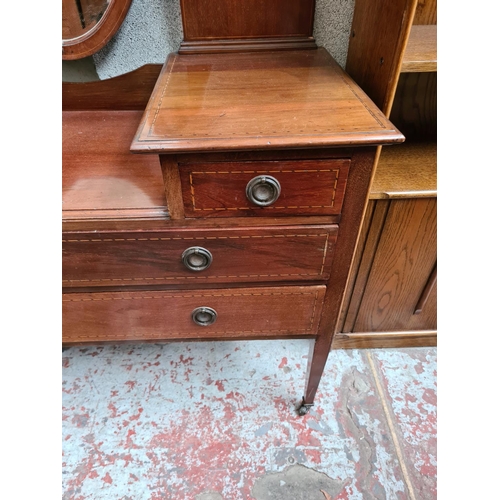 463 - An Edwardian inlaid mahogany four piece bedroom suite comprising dressing table with oval bevel edge... 